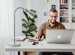 man using macbook