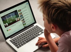 A Child watching Youtube videos on a laptop computer