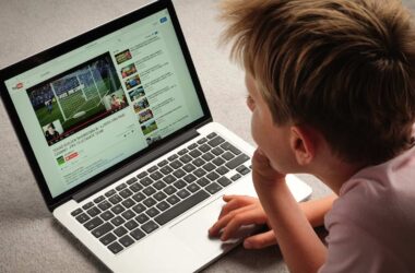 A Child watching Youtube videos on a laptop computer