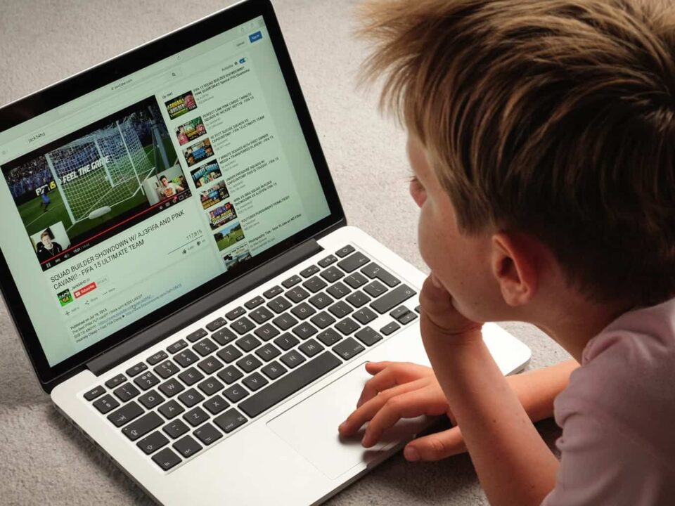 A Child watching Youtube videos on a laptop computer