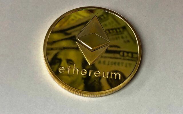 round gold colored ethereum ornament