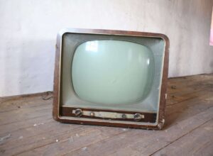 vintage brown crt tv on parquet wood flooring
