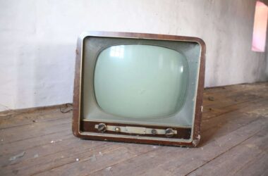 vintage brown crt tv on parquet wood flooring