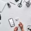 top view photo of person holding earphones