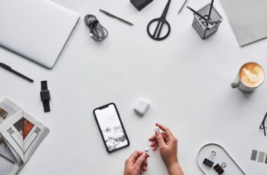 top view photo of person holding earphones